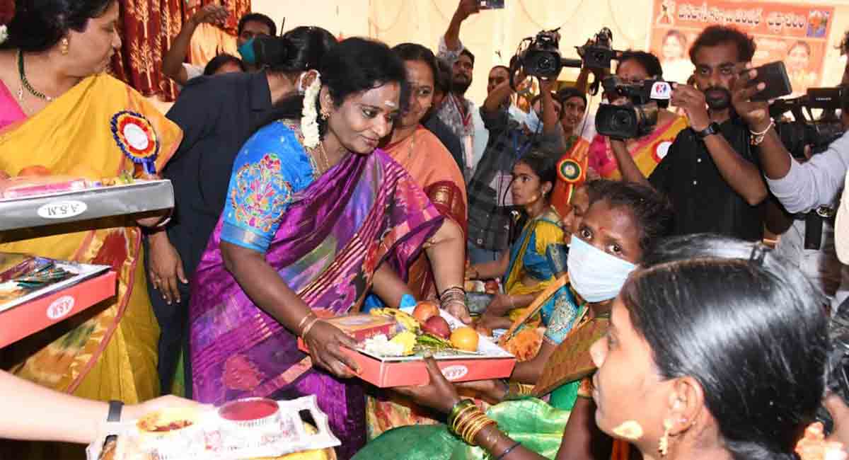 Tamilisai performs seemantham of tribal pregnant women at Bhadrachalam