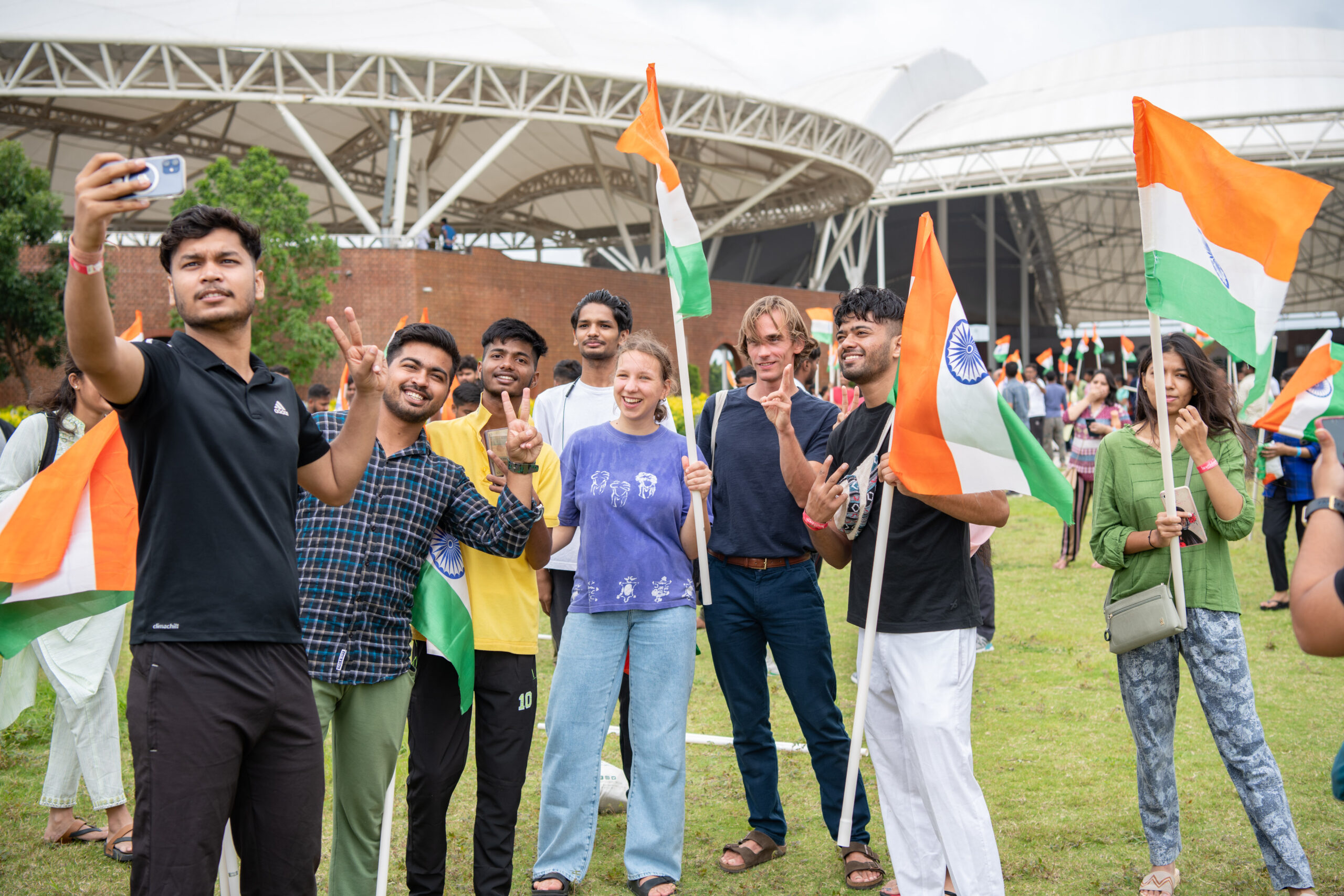 Hyderabad: Youth from across the world wave the Indian National Flag at the world’s largest meditation center