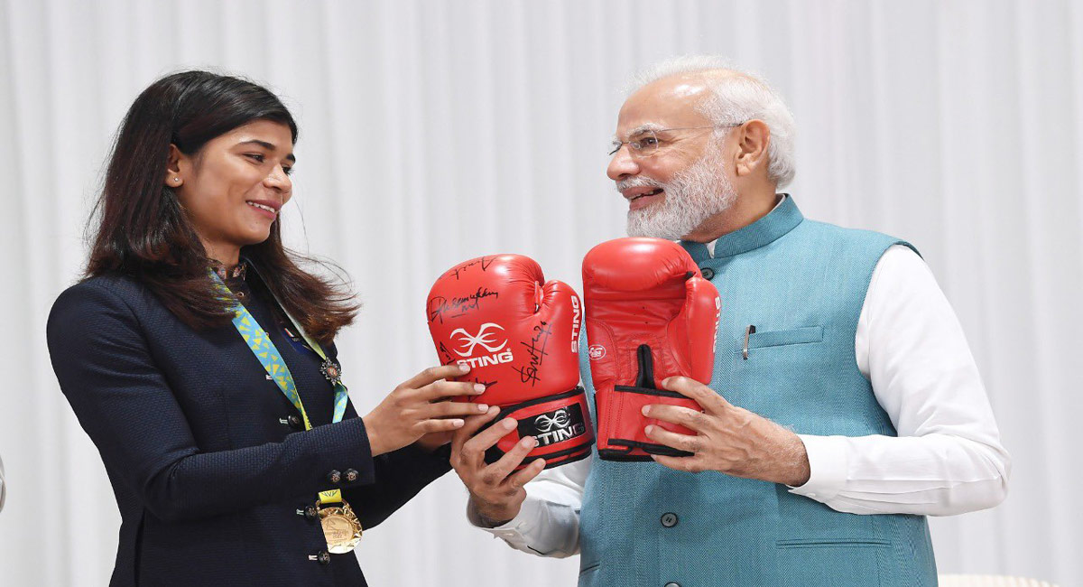 Nikhat gifts PM Modi boxing gloves, Hima gives traditional gamocha