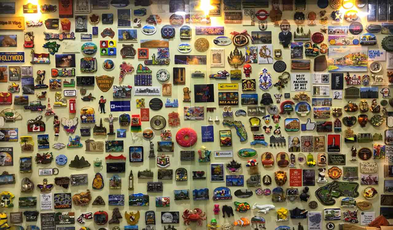 Wall of souvenir magnets sparks a book