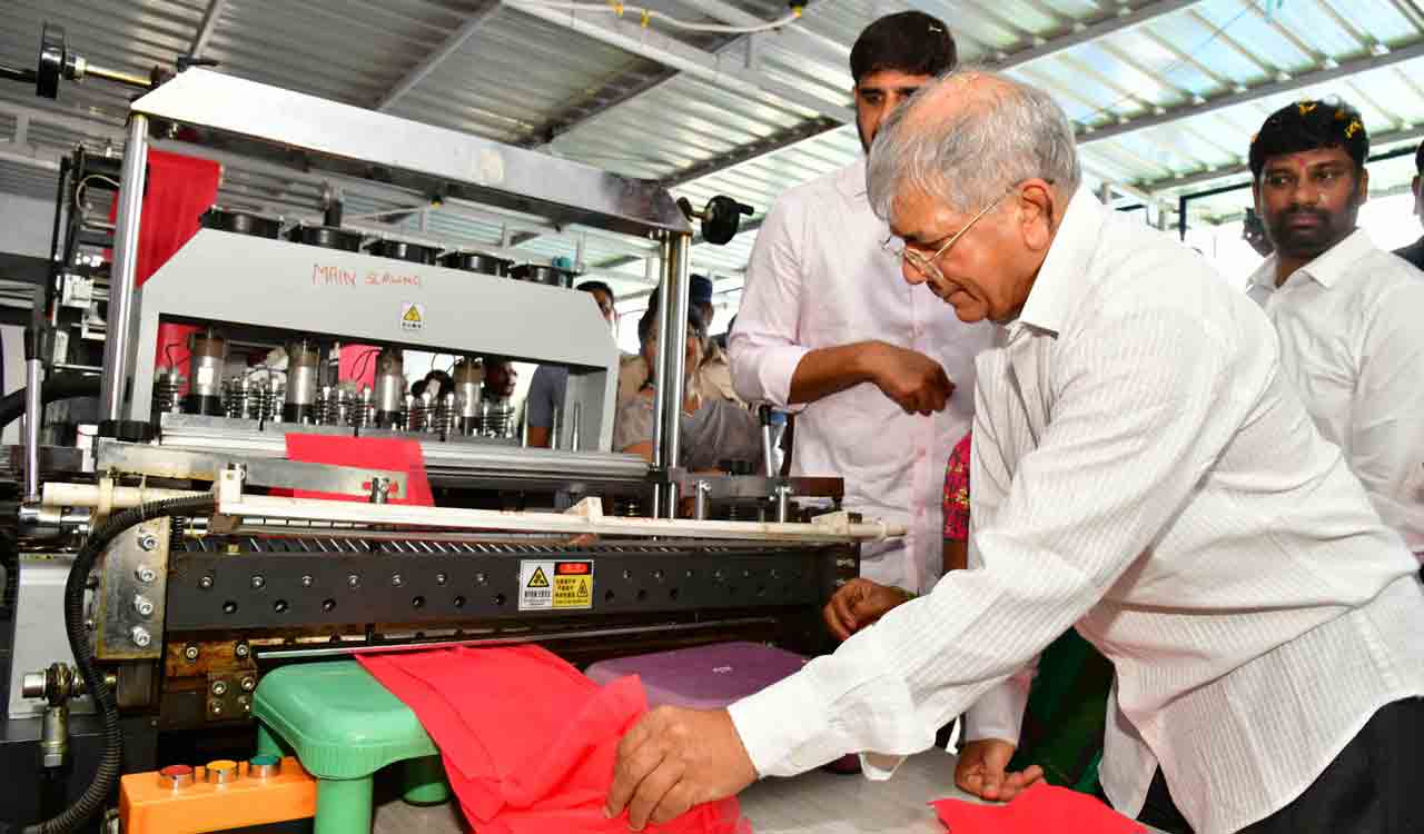 Prakash Ambedkar examining operating carry bags manufacturing machine established under dalit bandhu scheme in Huzurabad constituency on Friday.