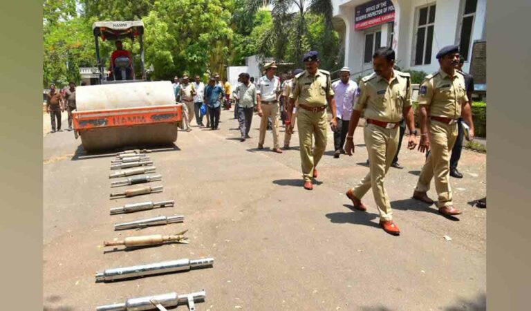 Modified silencers being destroyed at Karimnagar police Commissionerate.