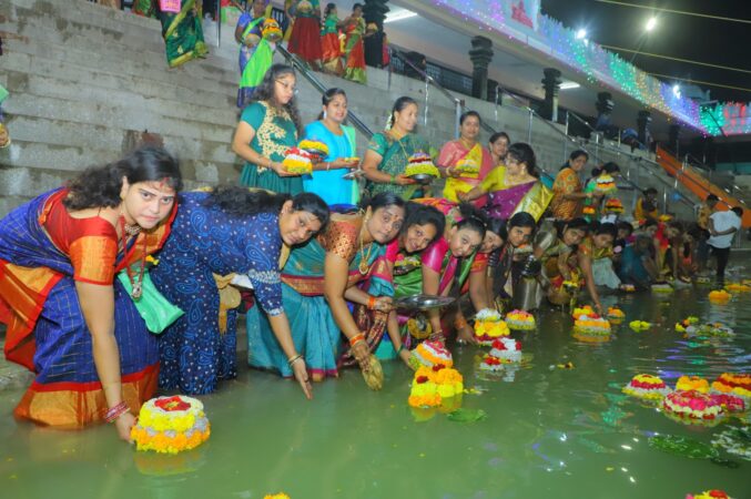 Women Leaving Bathukammas In Vemulawad Temple Tank After Playing Bathukamma As Part Of Engilipula Bathukamma Celebration Held In Vemulawada Temple Premises On Saturday Evening. 1 739