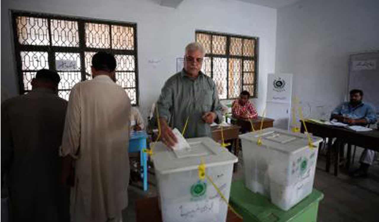Pakistan polls: Voting underway, security officer killed